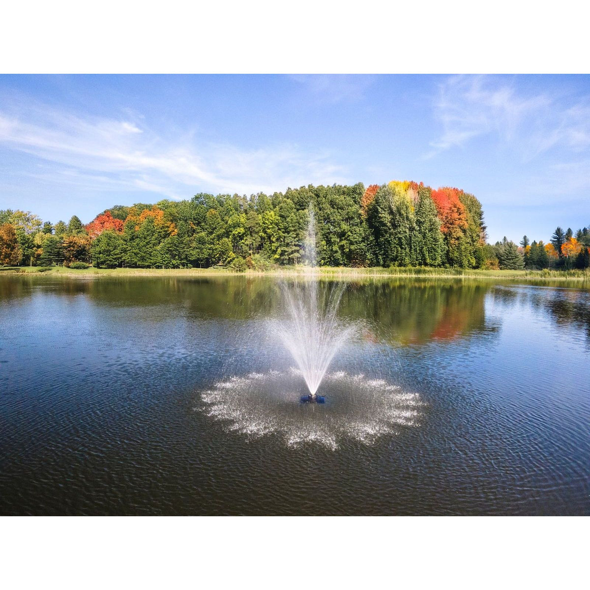 Scott Aerator Amherst Fountain In A Large Lake During Summer